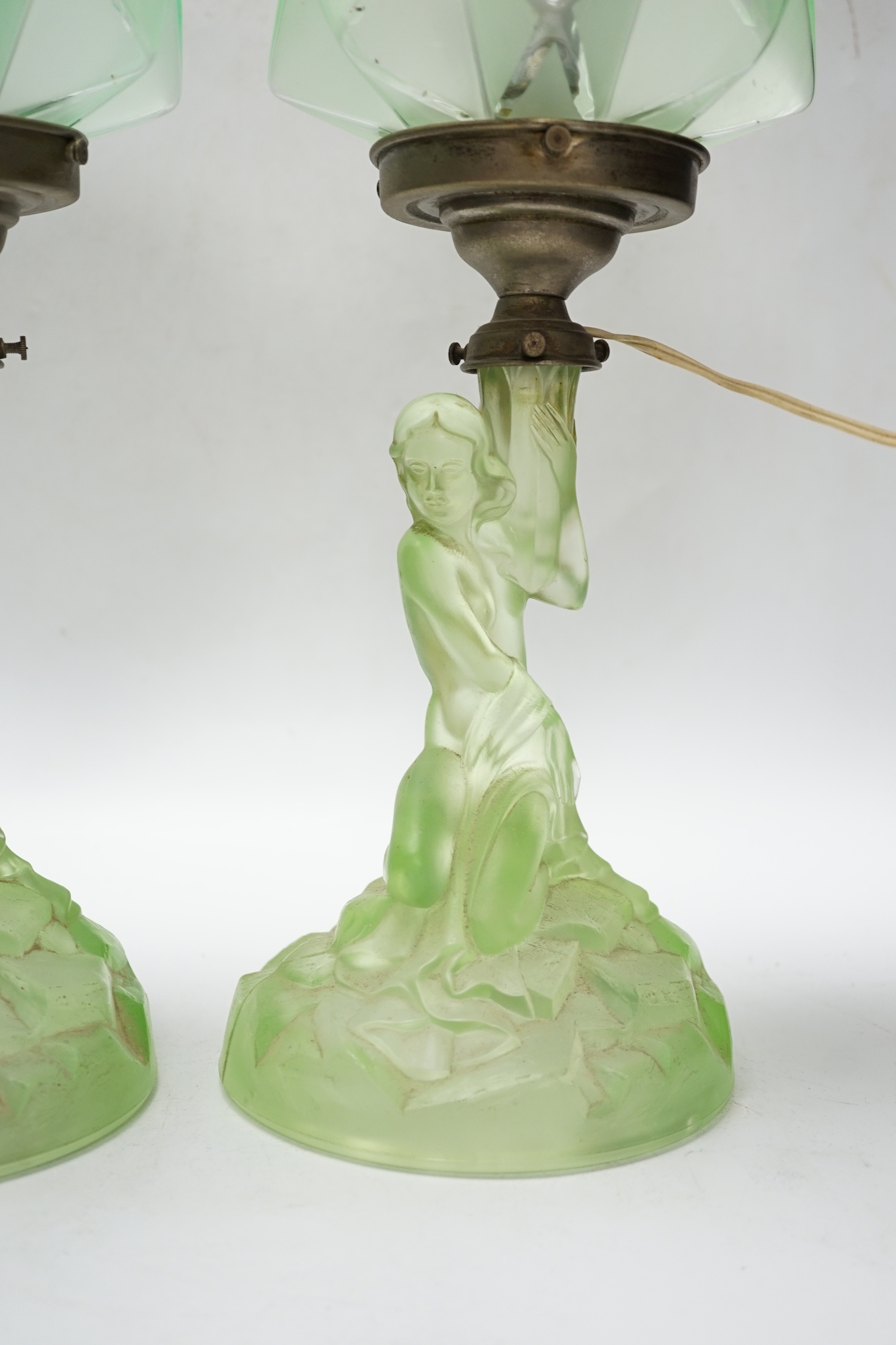 A pair of Art Deco press glass figural table lamps, 40cm